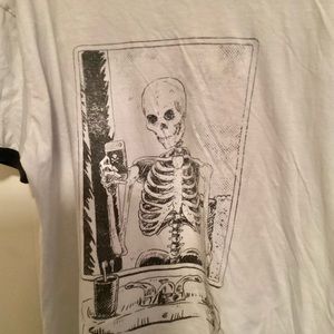 SKELETON TAKING A SELFIE IN A MIRROR.